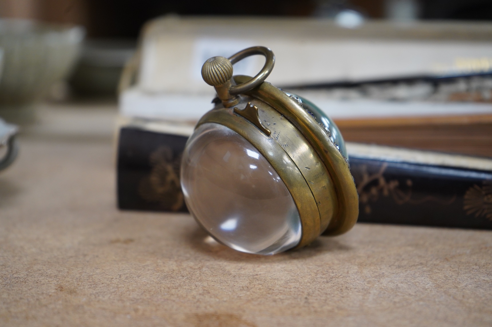 A French paste-mounted globular desk timepiece, 7cm in diameter